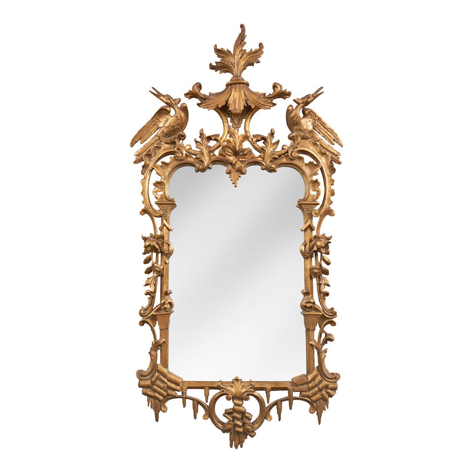 George III Style Giltwood Mirror, England,: George III Style Giltwood Mirror, England, in the Chinese Chippendale style, arched and scrolled frame embellished with rocaille work and blossoms, the crest with leafy canopy and flanked by two phoen