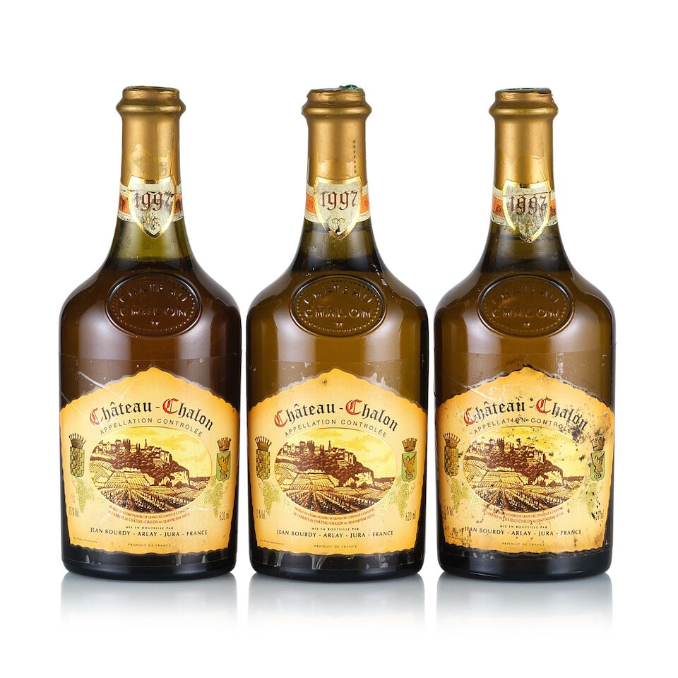 Château d'Arlay, Vin Jaune, Chateau Charlon, 1997 (3 x 620ml): Château d'Arlay, Vin Jaune, Chateau Charlon, 1997 (3 x 620ml) Region: Jura Fill Level: 2x into neck, 1x base of neck Capsule: ok Cork: ok Label: all taped and bin-soiled, 1x badly stained, 3x bin