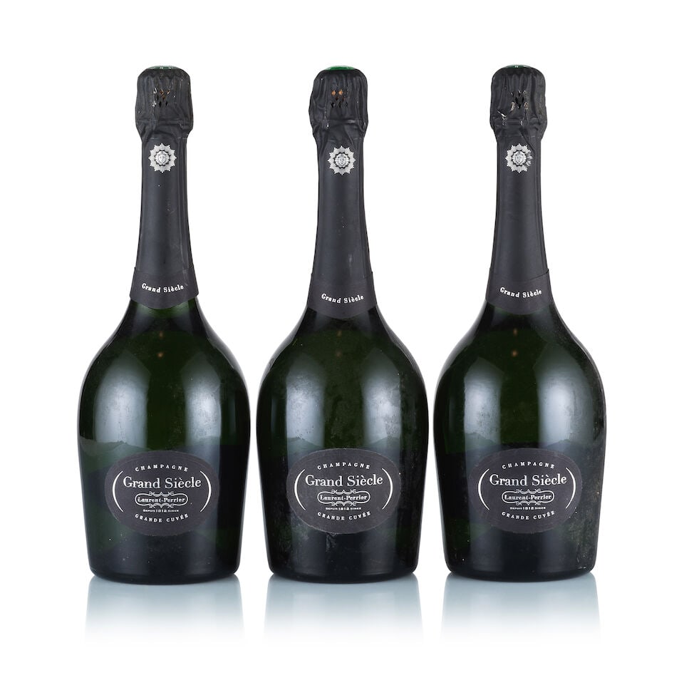 Champagne Laurent Perrier, Grand Siècle (3 x 750ml): Champagne Laurent Perrier, Grand Siècle (3 x 750ml) Region: Champagne Fill Level: excellent Capsule: ok Cork: ok Label: 2x slightly scuffed and slightly damp-affected, 1x good appearance Packagin