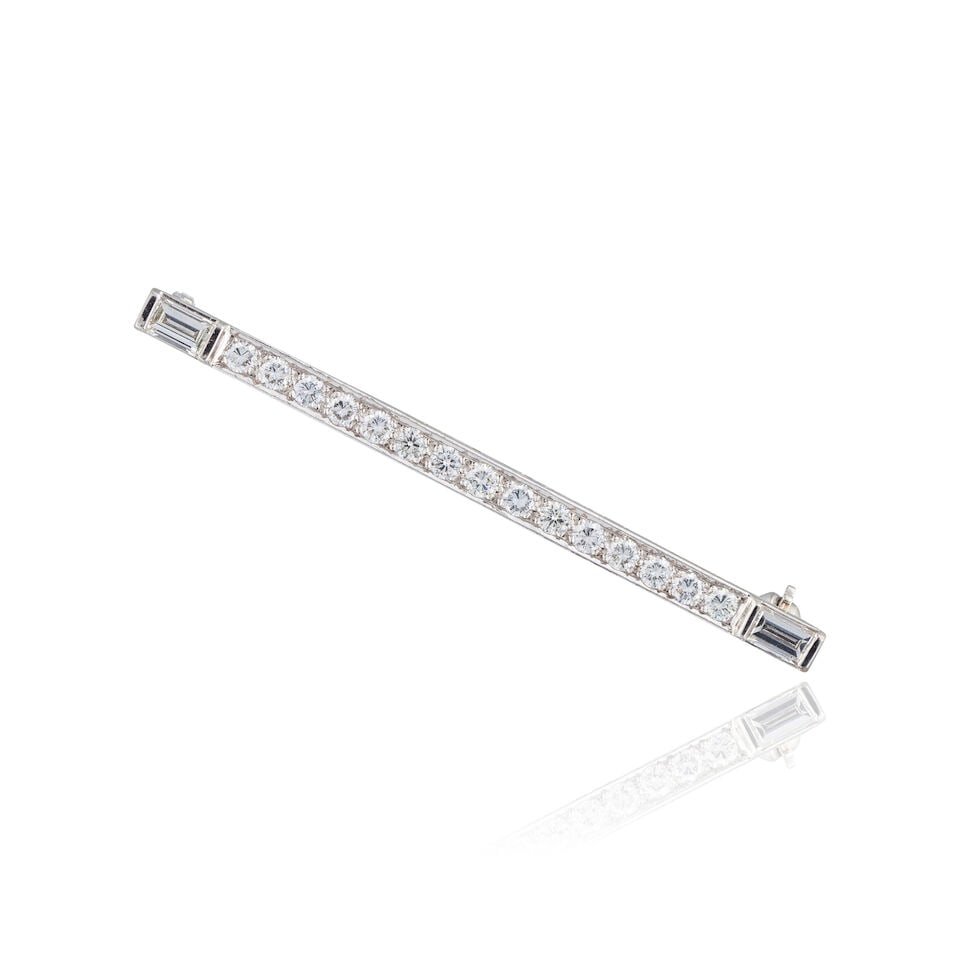 DIAMOND BROOCH BROCHE DIAMANTS: DIAMOND BROOCH BROCHE DIAMANTS • French import mark for 18 carat white gold (750 ‰) ​ • 15 brilliant-cut diamonds and 2 baguette-cut diamonds weighing approximately 0.70 ct