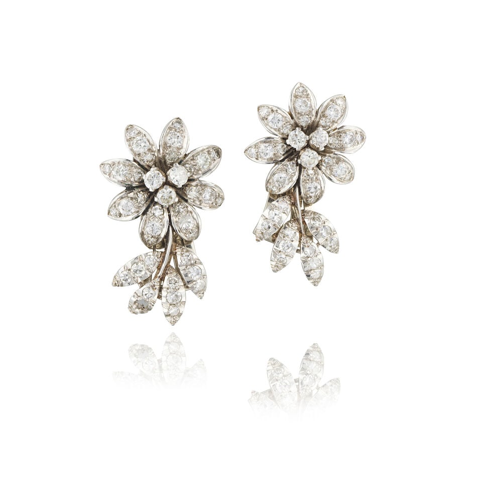 PAIR OF DIAMOND EARRINGS PAIRE DE BOUCLES D'OREILLES DIAMANTS: PAIR OF DIAMOND EARRINGS PAIRE DE BOUCLES D'OREILLES DIAMANTS • French import mark for 14 carat white gold (585 ‰) • Single and brilliant-cut diamonds weighing approximately 1.10 ct