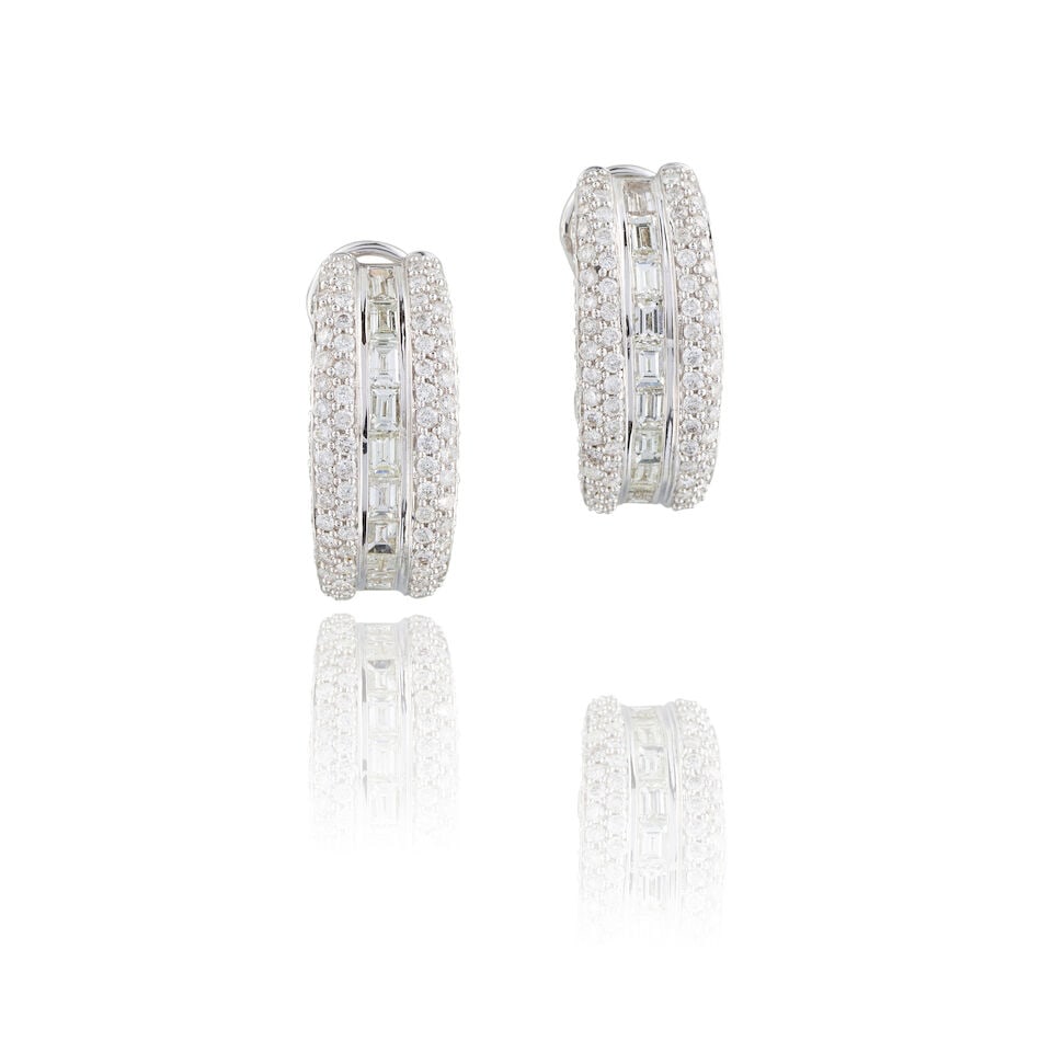 PAIR OF DIAMOND EARRINGS PAIRE DE BOUCLES D'OREILLES DIAMANTS: PAIR OF DIAMOND EARRINGS PAIRE DE BOUCLES D'OREILLES DIAMANTS • French import marks for 18 carat white gold (750 ‰) • Baguette and brilliant-cut diamonds weighing approximately 2.30