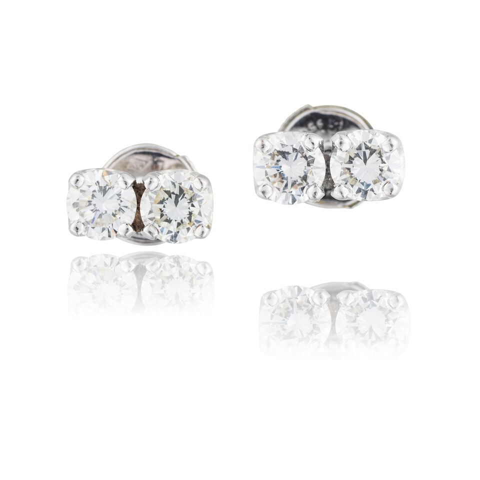 PAIR OF DIAMOND EARRINGS PAIRE DE BOUCLES D'OREILLES DIAMANTS: PAIR OF DIAMOND EARRINGS PAIRE DE BOUCLES D'OREILLES DIAMANTS • French import mark for 18 carat white gold (750 ‰) • 4 brilliant-cut diamonds weighing approximately 1.52 ct total