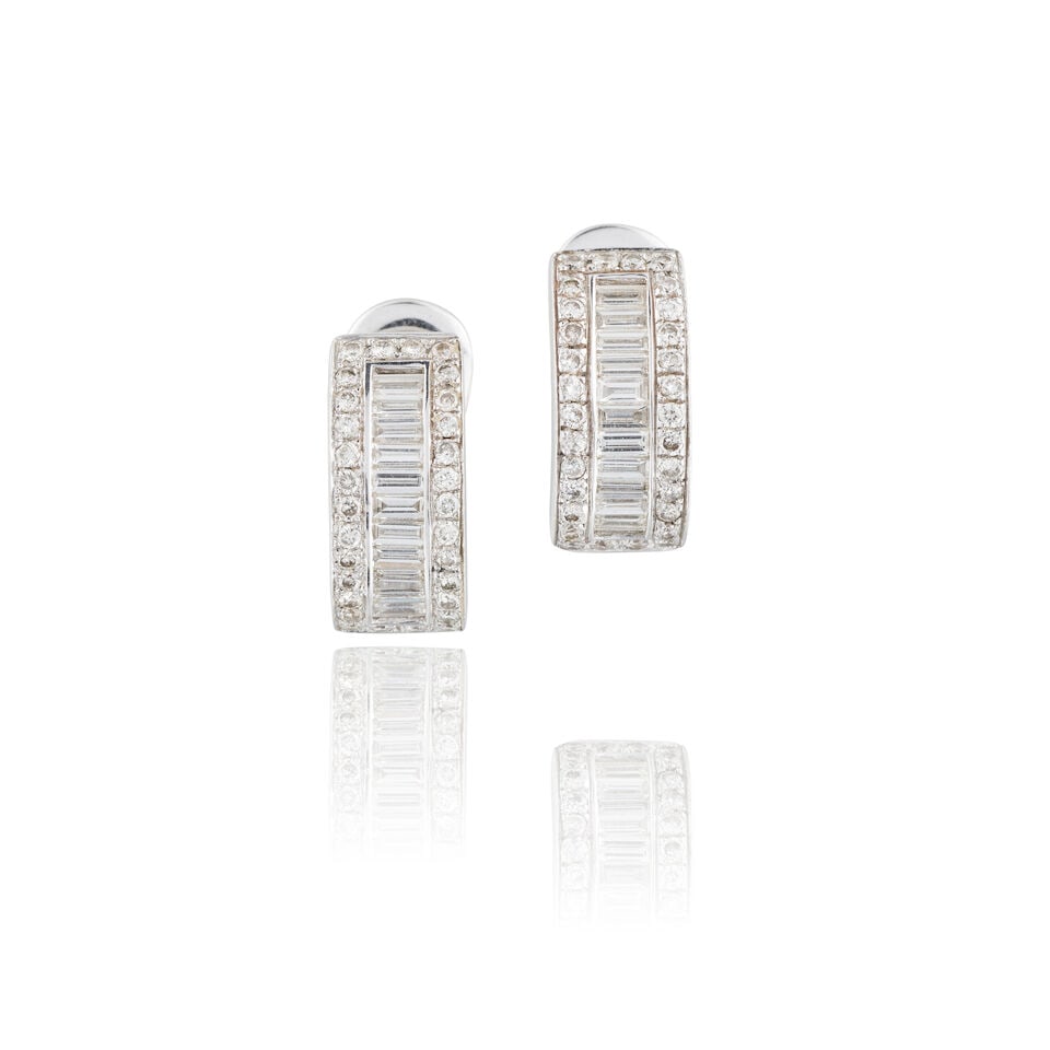 PAIR OF DIAMOND EARRINGS PAIRE DE BOUCLES D'OREILLES DIAMANTS: PAIR OF DIAMOND EARRINGS PAIRE DE BOUCLES D'OREILLES DIAMANTS • French assay marks for 18 carat white gold (750 ‰) • Baguette and brilliant-cut diamonds weighing approximately 1.80
