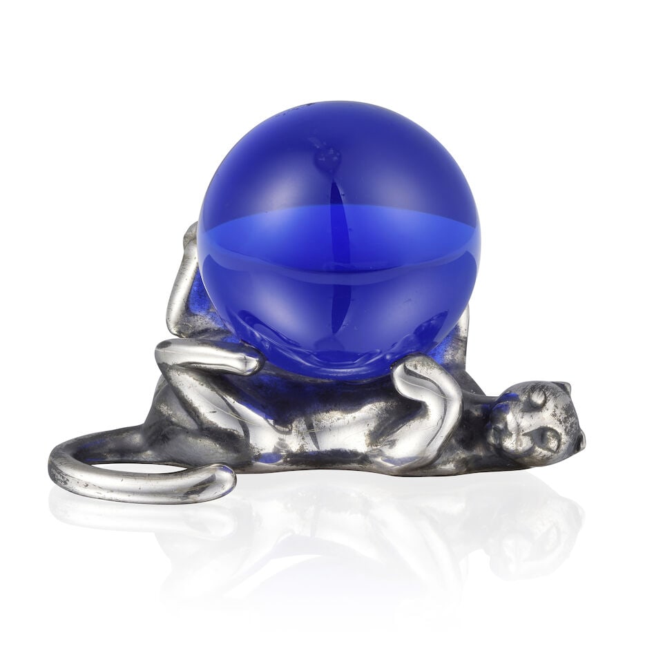 CARTIER: SILVER PANTHER AND BLUE GLASS PAPER WEIGHT CARTIER: PRESSE-PAPIER PANTHÈRE ARGENT...: CARTIER: SILVER PANTHER AND BLUE GLASS PAPER WEIGHT CARTIER: PRESSE-PAPIER PANTHÈRE ARGENT ET VERRE BLEU • French import mark for silver (800 ‰) • Designed as a panther supporti