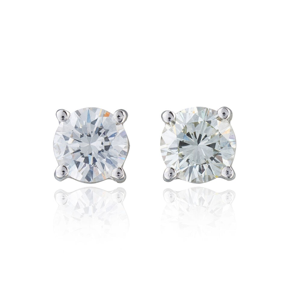 PAIR OF DIAMOND EARRINGS PAIRE DE BOUCLES D'OREILLES DIAMANTS: PAIR OF DIAMOND EARRINGS PAIRE DE BOUCLES D'OREILLES DIAMANTS • French import mark for 18 white gold (750 ‰) • 2 brilliant-cut diamonds weighing approximately 1.50 ct total