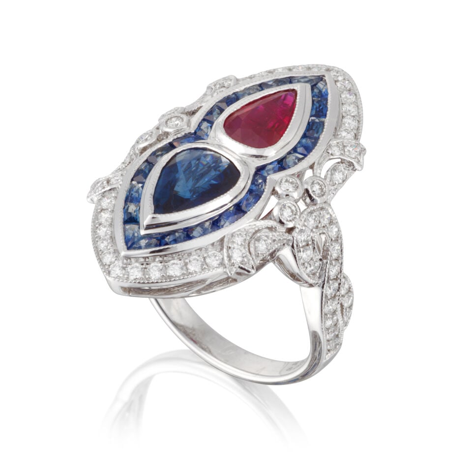 RUBY, SAPPHIRE AND DIAMOND RING BAGUE RUBIS, SAPHIRS ET DIAMANTS: RUBY, SAPPHIRE AND DIAMOND RING BAGUE RUBIS, SAPHIRS ET DIAMANTS • French import mark for 18 carat white gold (750 ‰) • 1 pear shaped ruby • 1 pear shaped and numerous
