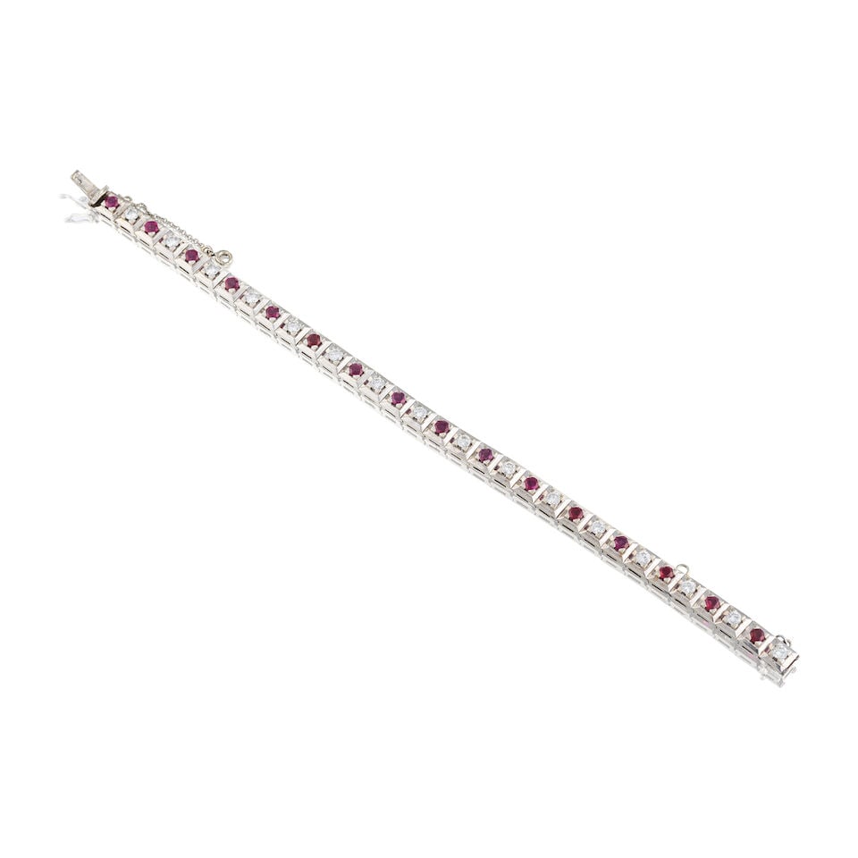RUBY AND DIAMONDS BRACELET BRACELET RUBIS ET DIAMANTS: RUBY AND DIAMONDS BRACELET BRACELET RUBIS ET DIAMANTS • French import mark for 18 carat white gold (750 ‰) • 16 circular-cut rubies weighing approximately 1.60 ct total • 16