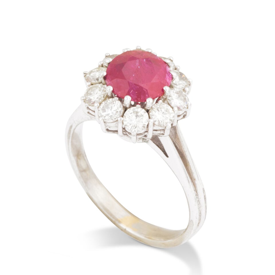 RUBY AND DIAMOND RING BAGUE RUBIS ET DIAMANTS: RUBY AND DIAMOND RING BAGUE RUBIS ET DIAMANTS • French import mark for 18 carat white gold (750 ‰) • 1 circular-cut ruby • 10 brilliant-cut diamonds weighing approximately 0.60