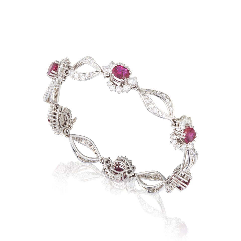 RUBY AND DIAMOND BRACELET BRACELET RUBIS ET DIAMANTS: RUBY AND DIAMOND BRACELET BRACELET RUBIS ET DIAMANTS • French import mark for 18 carat white gold (750 ‰) ​ • 6 oval-cut and cushion-cut rubies weighing approximately 4.50 cts