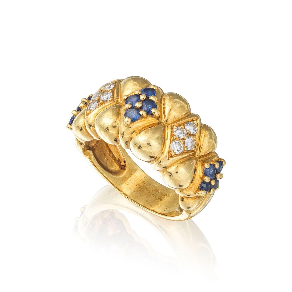 MAUBOUSSIN: SAPPHIRE AND DIAMOND RING MAUBOUSSIN: BAGUE SAPHIRS ET DIAMANTS: MAUBOUSSIN: SAPPHIRE AND DIAMOND RING MAUBOUSSIN: BAGUE SAPHIRS ET DIAMANTS • French assay mark for 18 carat yellow gold (750 ‰) • 12 circular-cut sapphires ​weighing