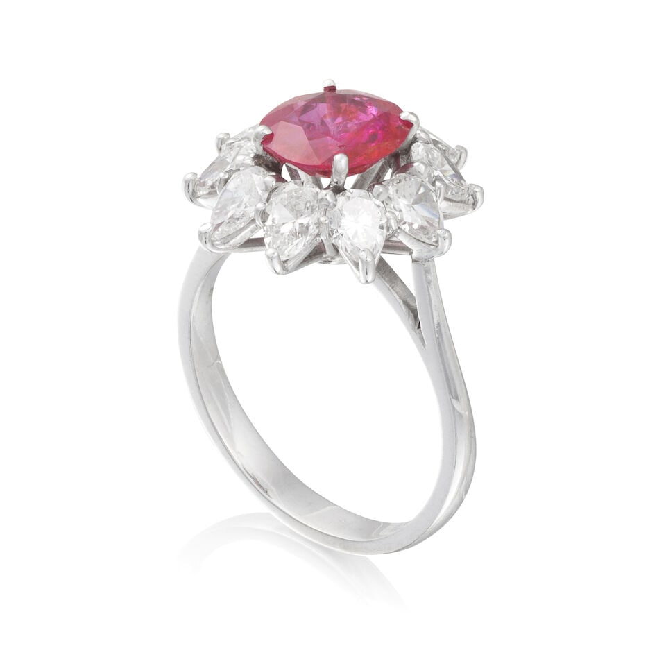 RUBY AND DIAMOND RING BAGUE RUBIS ET DIAMANTS: RUBY AND DIAMOND RING BAGUE RUBIS ET DIAMANTS • French import mark for 18 carat white gold (750 ‰) • 1 circular-cut ruby • 10 pear-shaped diamonds weighing approximately 1.40-1