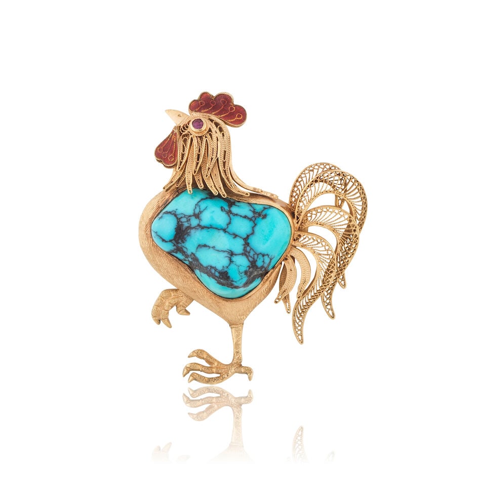 RUBY TURQUOISE AND ENAMEL'ROOSTER' BROOCH BROCHE 'COQ' RUBIS, TURQUOISE ET EMAIL: RUBY TURQUOISE AND ENAMEL'ROOSTER' BROOCH BROCHE 'COQ' RUBIS, TURQUOISE ET EMAIL • French import mark for 14 carat gold (585 ‰) • Of rooster design with chiseled and filigree