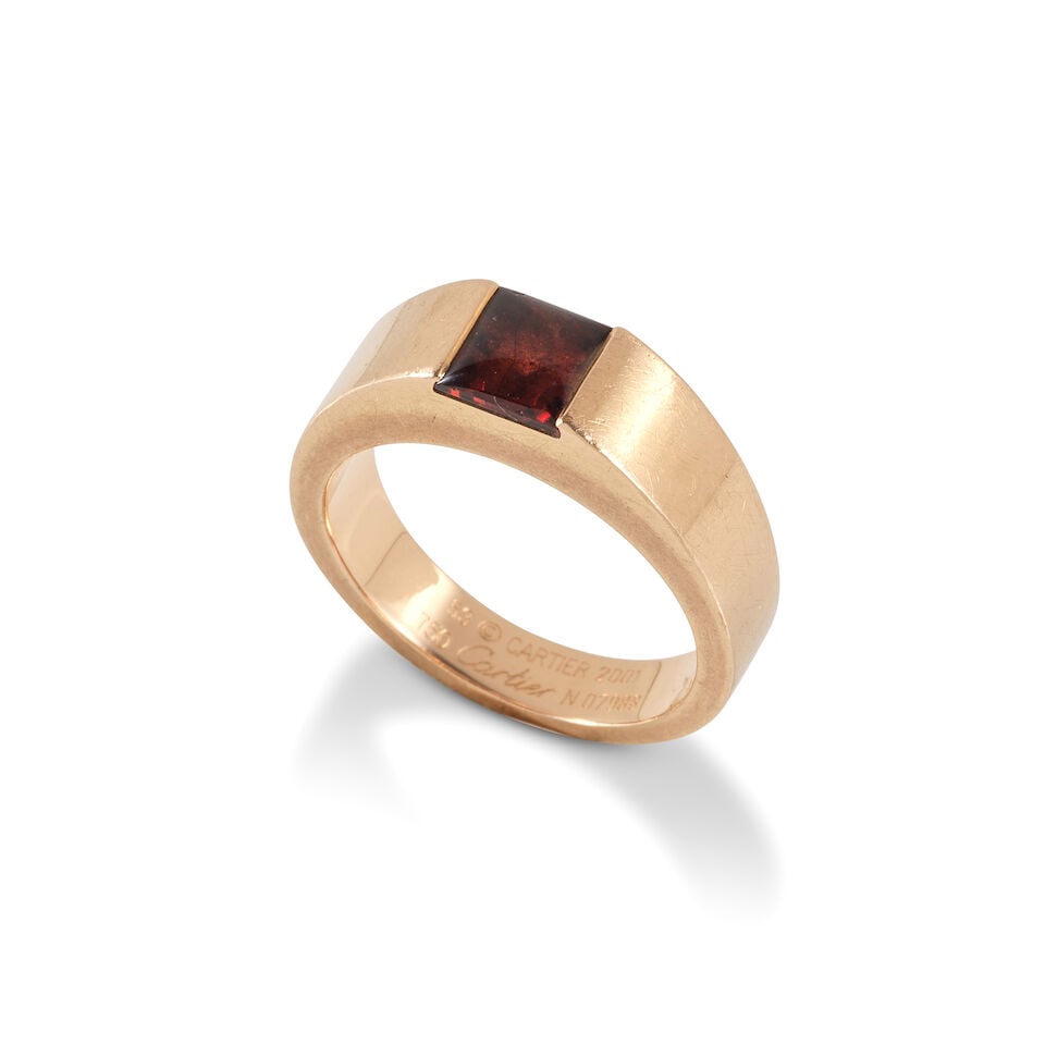 CARTIER : GARNET 'TANK' RING CARTIER: BAGUE 'TANK' GRENAT: CARTIER : GARNET 'TANK' RING CARTIER: BAGUE 'TANK' GRENAT • French mark for 18 carat rose gold (750 ‰) • 1 square-shaped garnet cabochon • Ring size 53 (FR) - M (UK) • Gr