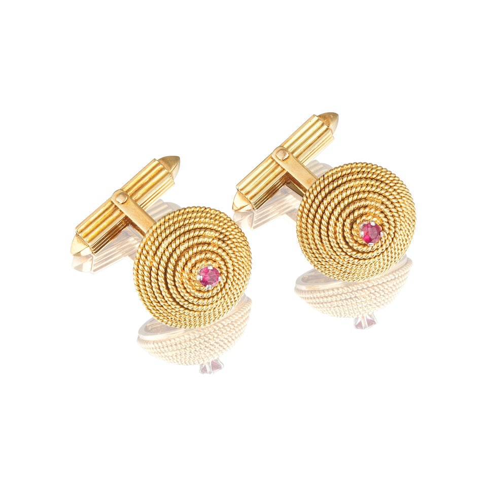 PAIR OF RUBY CUFFLINKS PAIRE DE BOUTONS DE MANCHETTE RUBIS: PAIR OF RUBY CUFFLINKS PAIRE DE BOUTONS DE MANCHETTE RUBIS • French import mark for 18 carat yellow gold (750 ‰) and for platinum (850 ‰) ​ • 2 circular-cut rubies ​