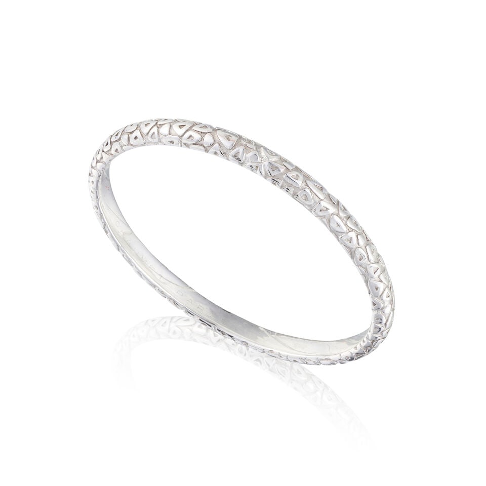 CHAUMET PARIS: GOLD BANGLE CHAUMET PARIS: BRACELET JONC EN OR: CHAUMET PARIS: GOLD BANGLE CHAUMET PARIS: BRACELET JONC EN OR • French assay mark for 18 carat white gold (750 ‰) ​ ​ • Inner circumference 20 cm • Gross weight