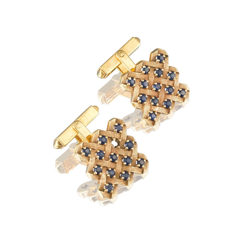 PAIR OF SAPPHIRE CUFFLINKS PAIRE DE BOUTONS DE MANCHETTE SAPHIRS: PAIR OF SAPPHIRE CUFFLINKS PAIRE DE BOUTONS DE MANCHETTE SAPHIRS • French import mark for 14 carat yellow gold (585 ‰) • Circular-cut sapphires ​weighing approximately 1.25 ct
