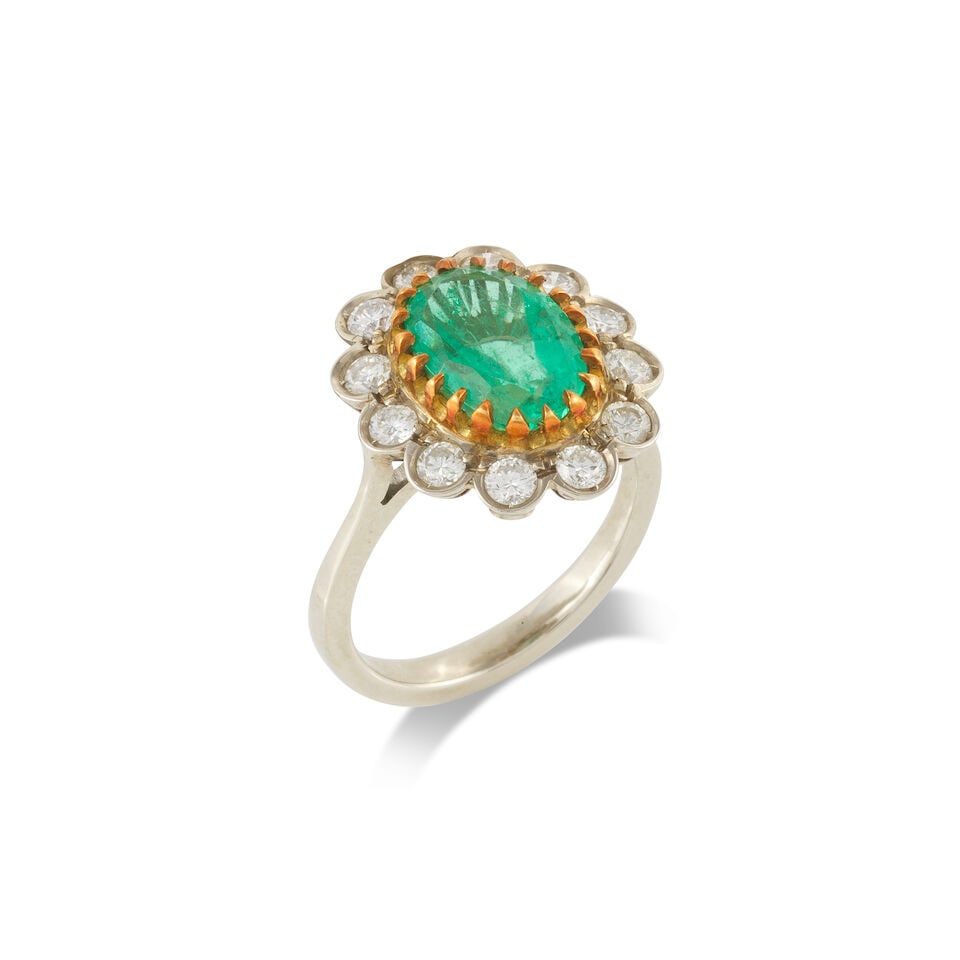 EMERALD AND DIAMOND RING BAGUE ÉMERAUDE ET DIAMANTS: EMERALD AND DIAMOND RING BAGUE ÉMERAUDE ET DIAMANTS • French import mark for 18 carat gold (750 ‰) • 1 oval-cut emerald • 12 brilliant-cut diamonds weighing approximately