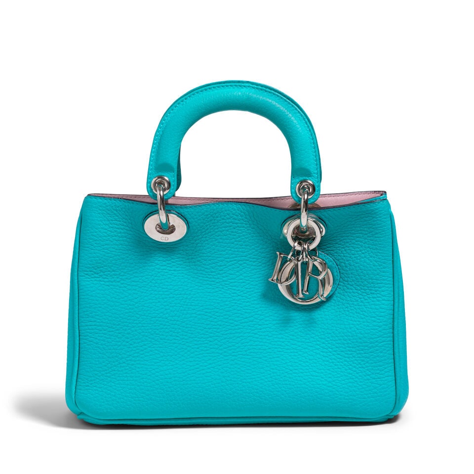 CHRISTIAN DIOR: BLUE SMALL DIORISSIMO LEATHER TOTE 2014 | Raf Simons: CHRISTIAN DIOR: BLUE SMALL DIORISSIMO LEATHER TOTE 2014 | Raf Simons • Blue Pebbled Calfskin Exterior • Silver Tone Hardware and Protective Feet at Base • Button Snap Closure •