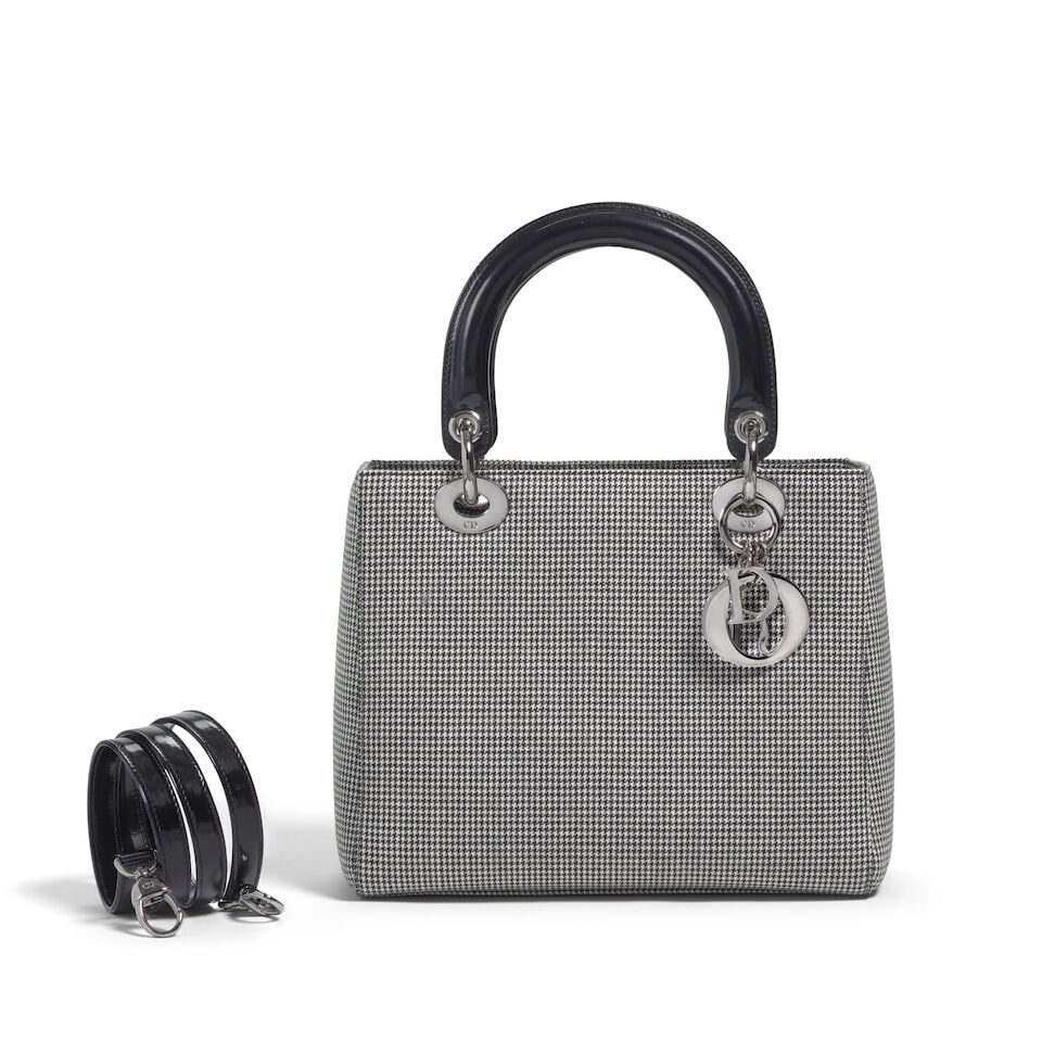 CHRISTIAN DIOR: HERRINGBONE WOOL MEDIUM LADY DIOR 1999 | John Galliano: CHRISTIAN DIOR: HERRINGBONE WOOL MEDIUM LADY DIOR 1999 | John Galliano • Black & White Herringbone Wool Exterior • Gunmetal Hardware and Protective Feet at Base • Zip Closure with CD