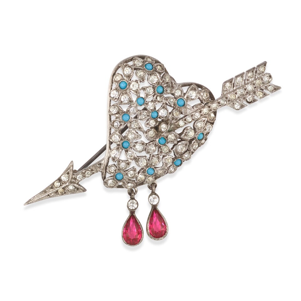 CHRISTIAN DIOR: HEART AND ARROW EMBELLISHED BROOCH 1959 | Yves Saint Laurent: CHRISTIAN DIOR: HEART AND ARROW EMBELLISHED BROOCH 1959 | Yves Saint Laurent • Silver Tone with Crystal and Simulated Turquoise Detail • Simulated Ruby Teardrop Detail • 6.5cm x 4cm