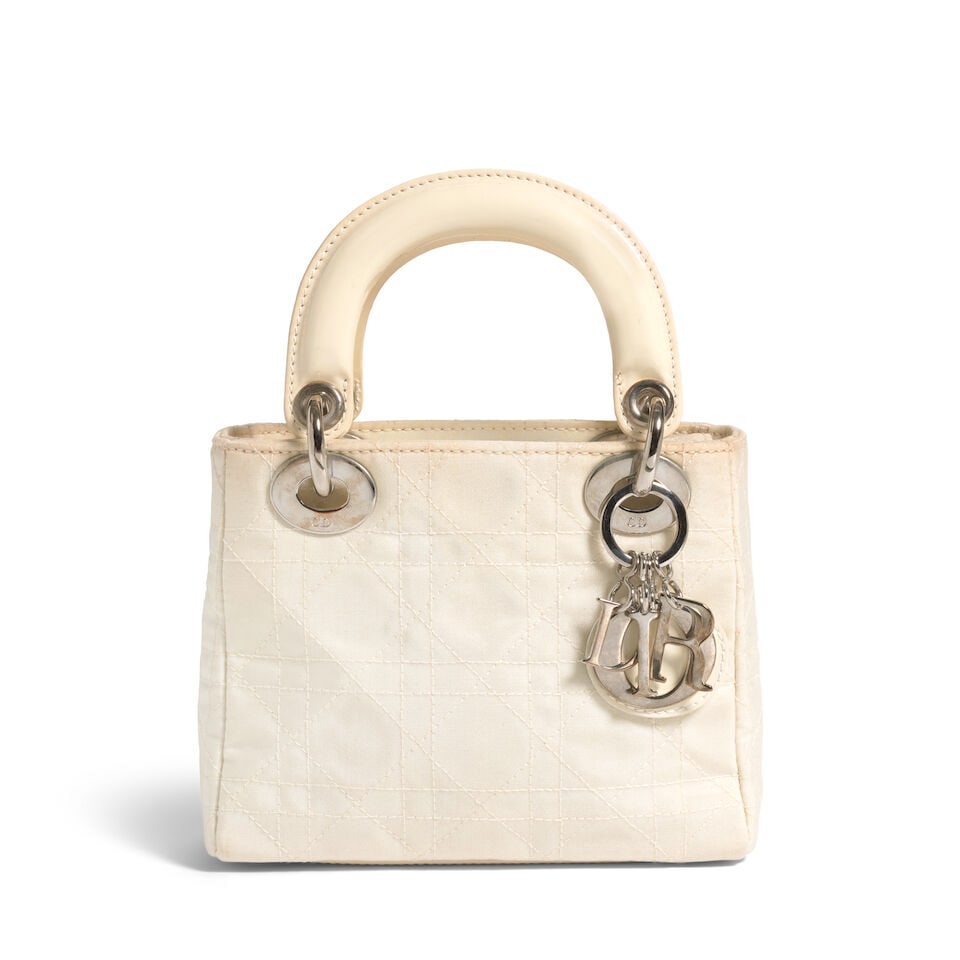 CHRISTIAN DIOR: IRIDESCENT CREAM CANNAGE NYLON MINI LADY DIOR 2003 | John Galliano: CHRISTIAN DIOR: IRIDESCENT CREAM CANNAGE NYLON MINI LADY DIOR 2003 | John Galliano • Iridescent Cream Cannage Quilted Exterior • Silver Tone Hardware and Protective Feet at Base • Fo