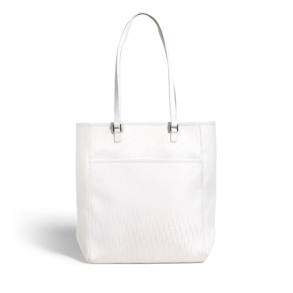 CHRISTIAN DIOR: WHITE DIORISSIMO CANVAS TROTTER TOTE 2004 | John Galliano: CHRISTIAN DIOR: WHITE DIORISSIMO CANVAS TROTTER TOTE 2004 | John Galliano • White Diorissimo Jacquard Canvas Exterior with Leather Trim Detail • Silver Tone Hardware • Exterior Patch