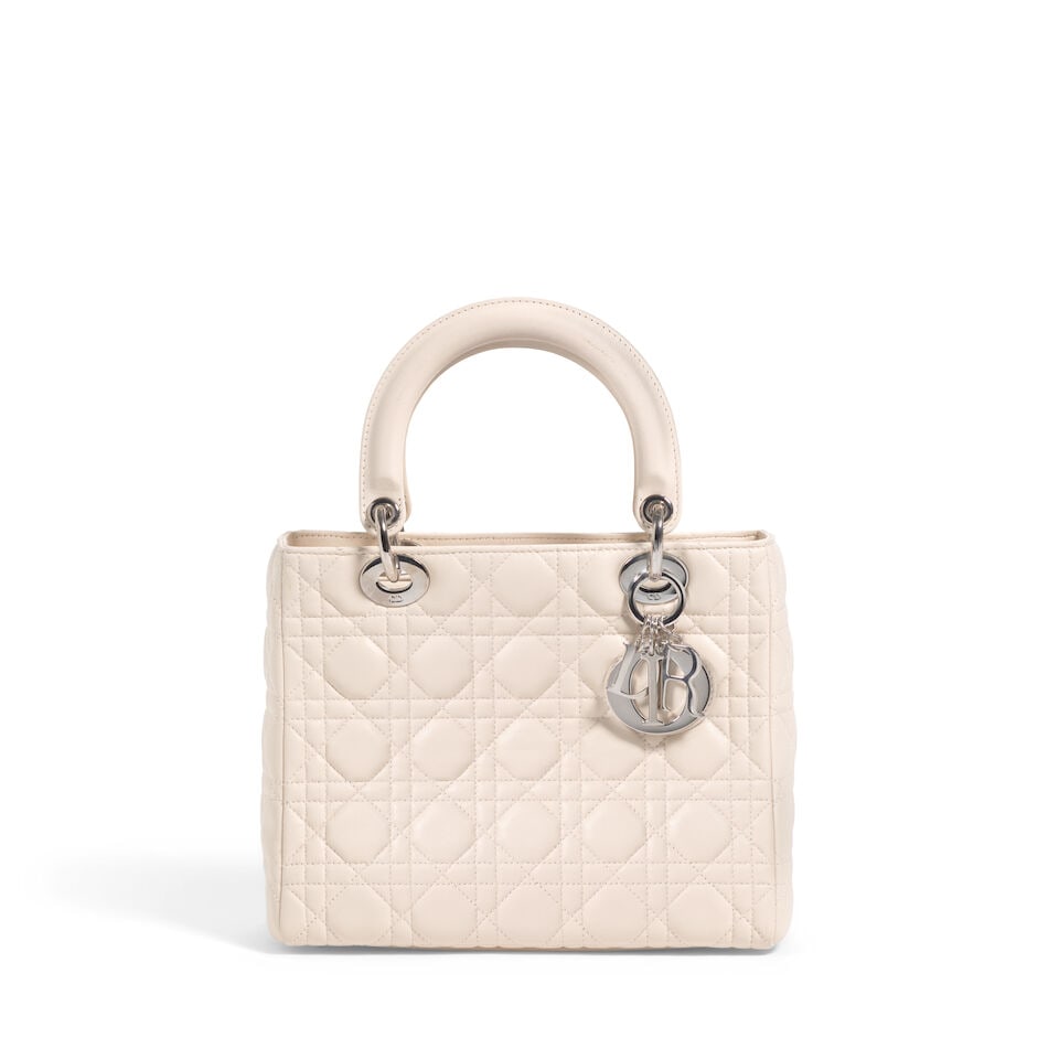 CHRISTIAN DIOR: CREAM CANNAGE LEATHER MEDIUM LADY DIOR 2005 | John Galliano: CHRISTIAN DIOR: CREAM CANNAGE LEATHER MEDIUM LADY DIOR 2005 | John Galliano • Cream Lambskin Cannage Quilted Exterior • Silver Tone Hardware and Protective Feet at Base • Zip Closure