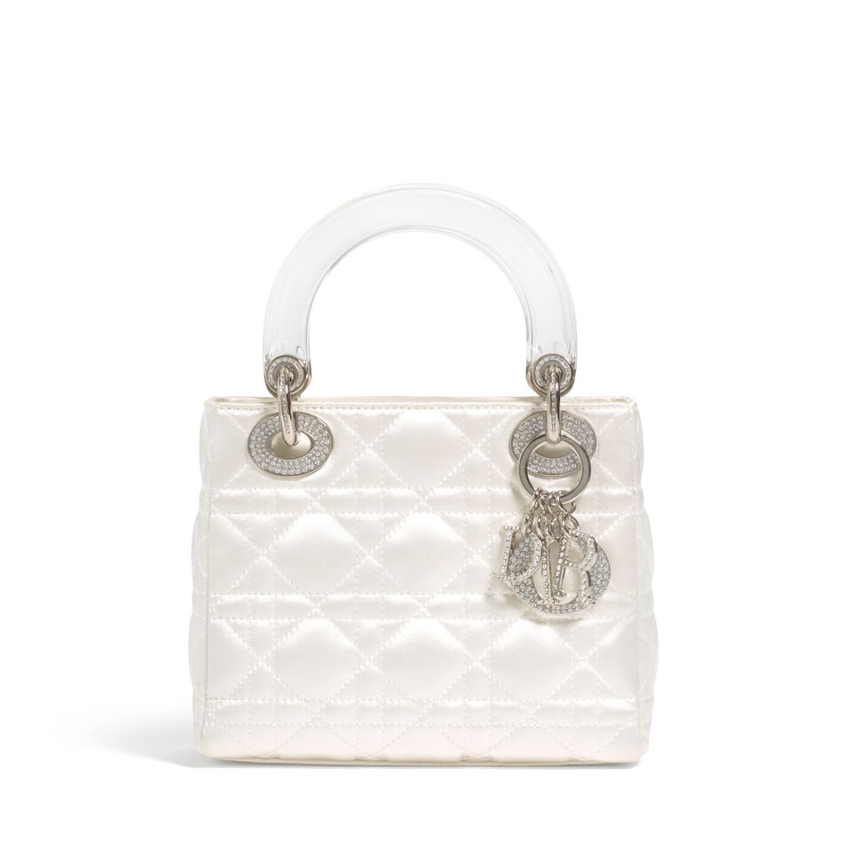 CHRISTIAN DIOR: WHITE SATIN CANNAGE MINI LADY DIOR 2010 | John Galliano: CHRISTIAN DIOR: WHITE SATIN CANNAGE MINI LADY DIOR 2010 | John Galliano • White Satin Cannage Quilted Exterior • Silver Tone Hardware • Fold In Flap Closure • Lucite Dual Flat