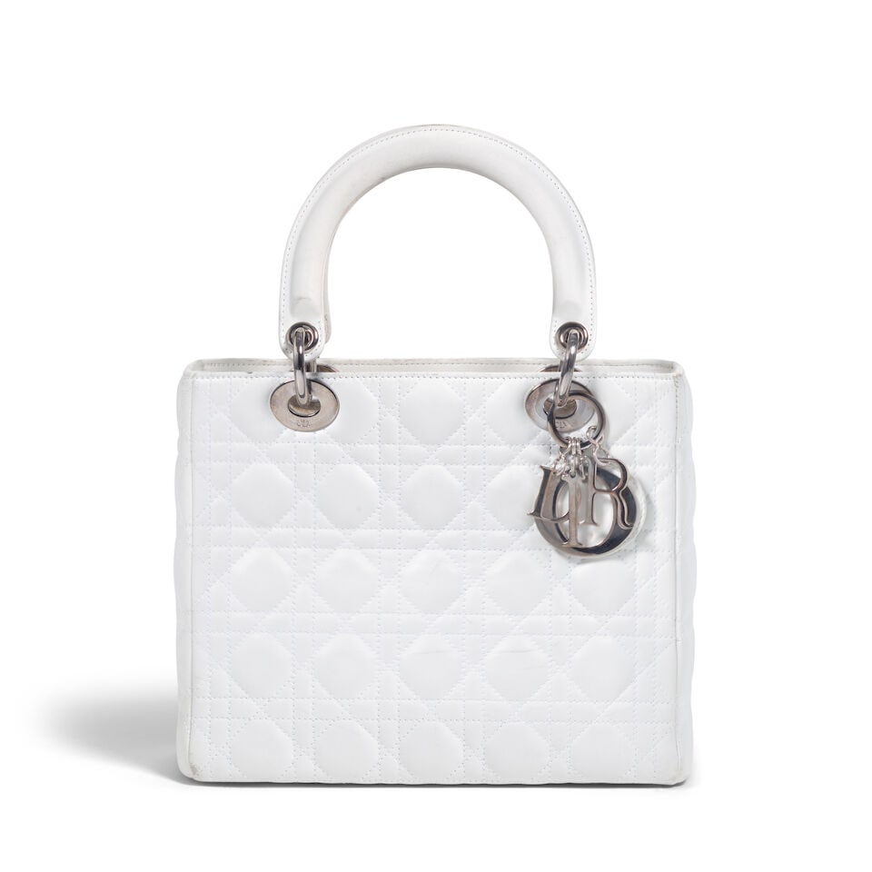CHRISTIAN DIOR: WHITE CANNAGE LEATHER MEDIUM LADY DIOR 2005 | John Galliano: CHRISTIAN DIOR: WHITE CANNAGE LEATHER MEDIUM LADY DIOR 2005 | John Galliano • White Lambskin Cannage Quilted Exterior • Silver Tone Hardware and Protective Feet at Base • Zip Closure