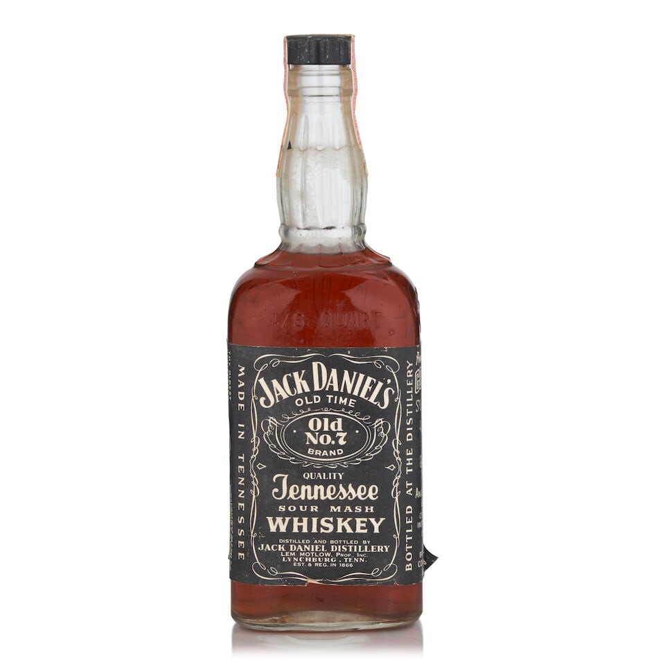 Jack Daniels, c.1964 (1 bottle, 4/5qt): Jack Daniels, c.1964 (1 bottle, 4/5qt) Region: Tennessee Capsule: tax strip worn on top of cap Alcohol content: no ABV or proof stated, presumed 40% Notes: official bottling Footnotes: United States L