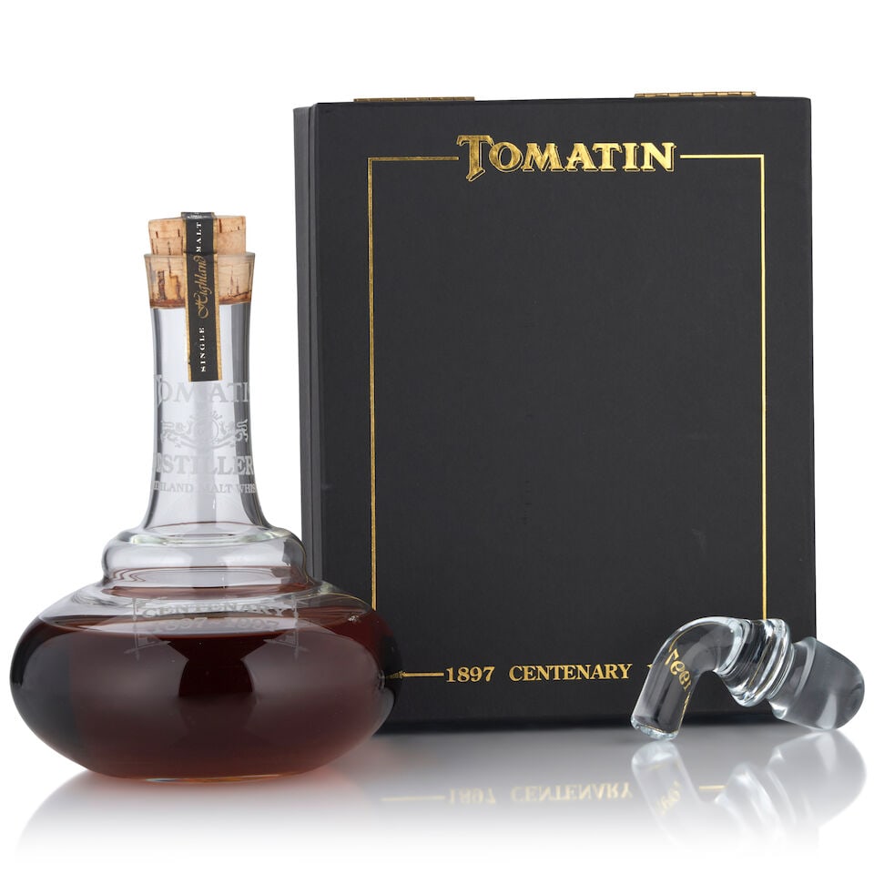 Tomatin Centenary Decanter (1 bottle, 700ml): Tomatin Centenary Decanter (1 bottle, 700ml) Region: Highland Fill Level: low fill Packaging: original case, includes glass stopper Alcohol content: 43% Notes: official bottling, bottle no. 115 Footno