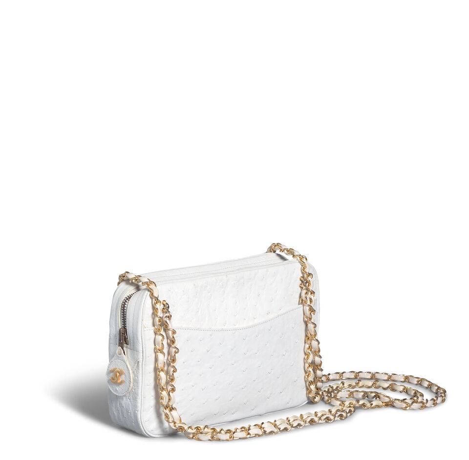CHANEL: WHITE OSTRICH LEATHER BAG 1989-1991: CHANEL: WHITE OSTRICH LEATHER BAG 1989-1991 • White Ostrich Leather • Gold Tone Hardware • Dual Leather and Chain Shoulder Straps • Two Exterior Pockets • Zipper Closure