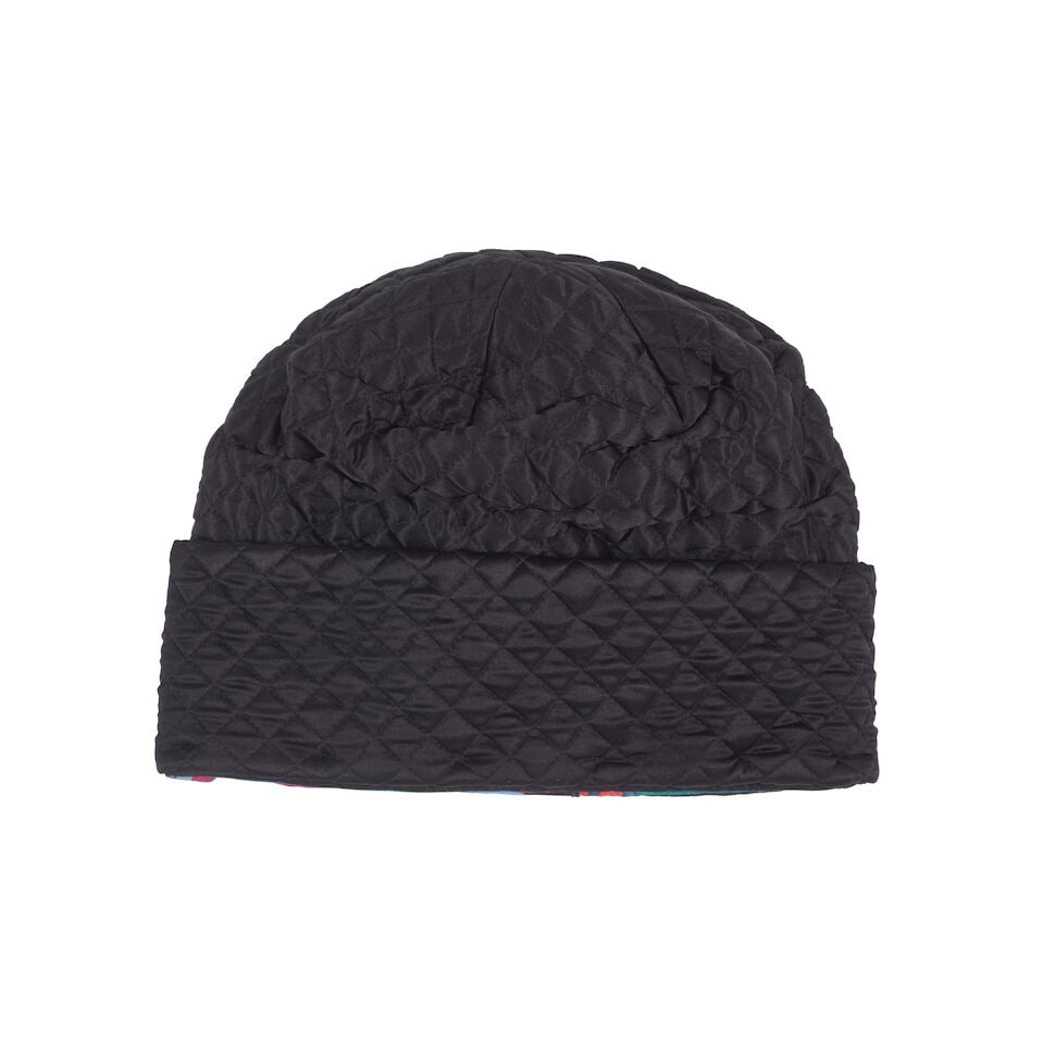 PUCCI: BLACK SILK QUILTED CAP WITH MULTICOLOR PRINT LINING: PUCCI: BLACK SILK QUILTED CAP WITH MULTICOLOR PRINT LINING • Marked Size III OVERALL CONDITION: Excellent | No visible flaws. The Condition Report represents Bonhams' reasonable opinion as to th