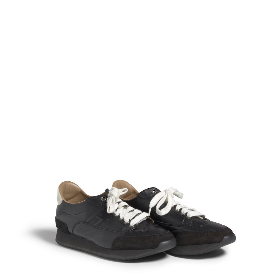 HERMÈS: BLACK H 'QUICK' LEATHER SNEAKERS: HERMÈS: BLACK H 'QUICK' LEATHER SNEAKERS • Marked Size 39 OVERALL CONDITION: Good | Light signs of wear throughout. The Condition Report represents Bonhams' reasonable opinion as to the Lot