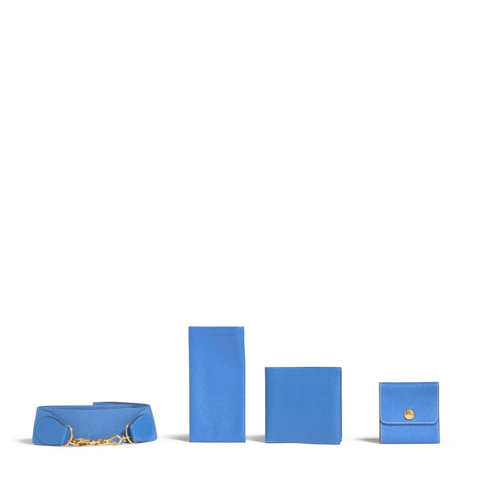 HERMÈS: A GROUP OF FOUR BLEU FRANCE LEATHER ACCESSORIES: HERMÈS: A GROUP OF FOUR BLEU FRANCE LEATHER ACCESSORIES • A Bifold Wallet | 1995 • An Eyeglass Pouch | 1993 • A Note Case | 1990 • A Toile Sangles Shoulder Strap OVERALL C