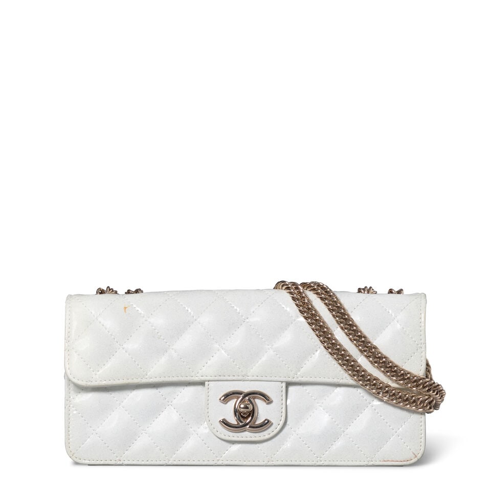 CHANEL: EVENING STAR EAST/WEST IRIDESCENT FLAP BAG 2008-2009: CHANEL: EVENING STAR EAST/WEST IRIDESCENT FLAP BAG 2008-2009 • White Quilted Patent Leather with Silver Glitter Detail Throughout • Silver Tone Hardware • Bijoux Chain Shoulder Strap