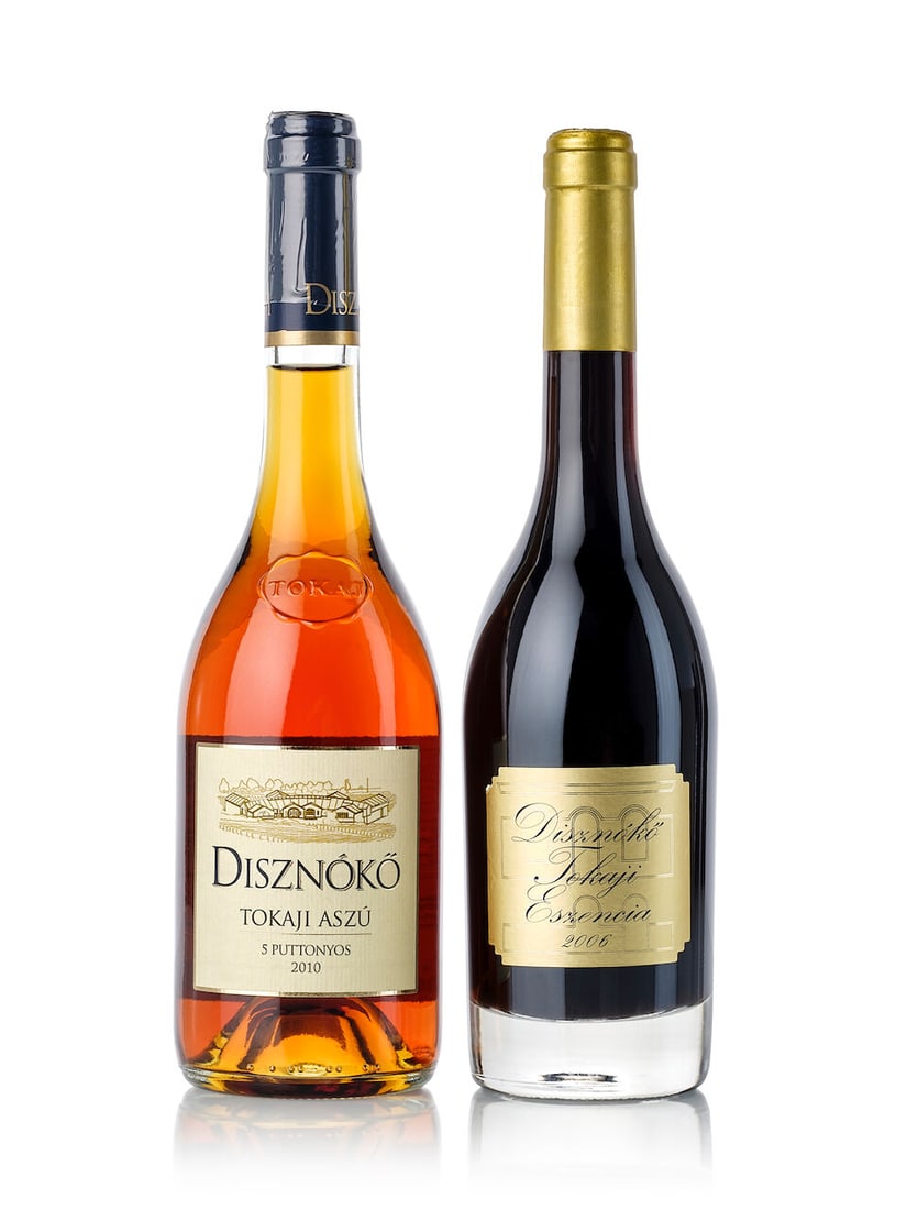 Disznókő Tokaji Aszú 5 Puttonyos, 2010 (6x 500ml) Disznókő Tokaji Eszen...: Disznókő Tokaji Aszú 5 Puttonyos, 2010 (6x 500ml) Region: Tokaj Packaging: oc6 Disznókő Tokaji Eszencia, 2006 (1x 500ml) Region: Tokaj Capsule: signs of old seepage Lot to be