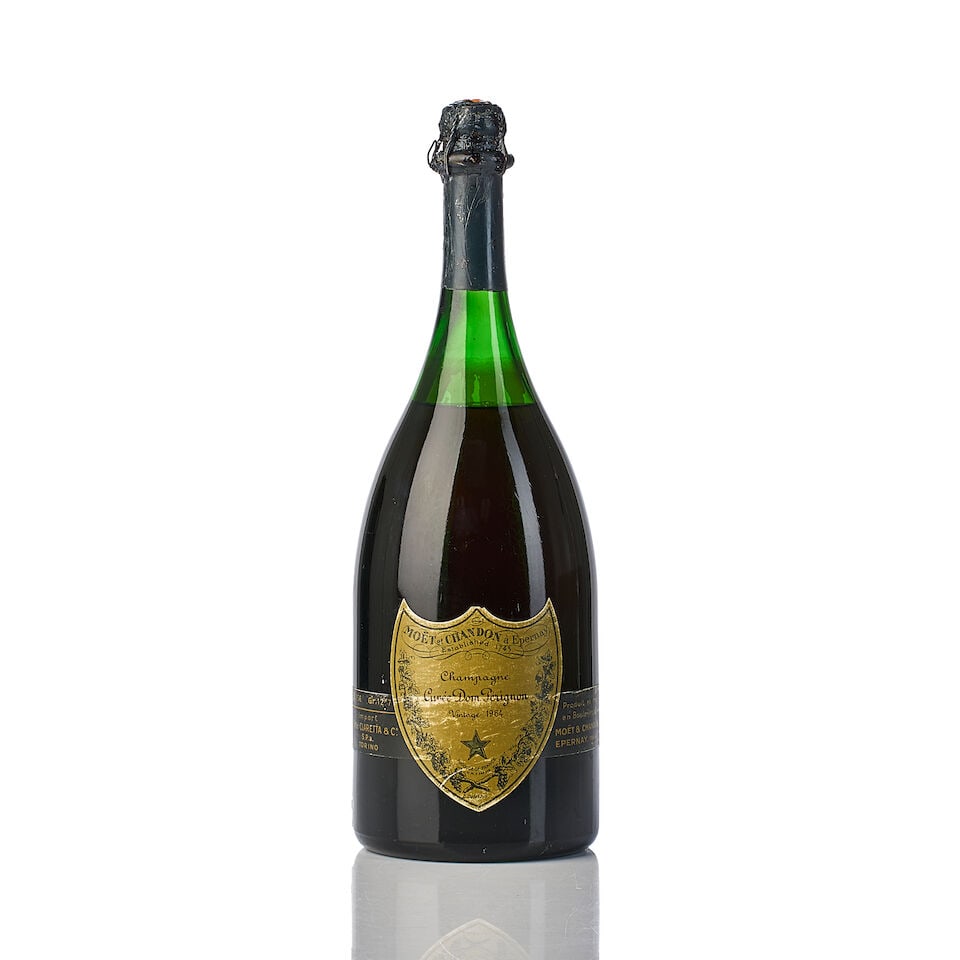 Dom Pérignon, 1964 (1x Magnum): Dom Pérignon, 1964 (1x Magnum) Region: Champagne Fill Level: 2.5cm inverted Capsule: scuffed & slightly oxidized foil, slightly rusty muselet Cork: with signs of old seepage Label: scuffed For fu