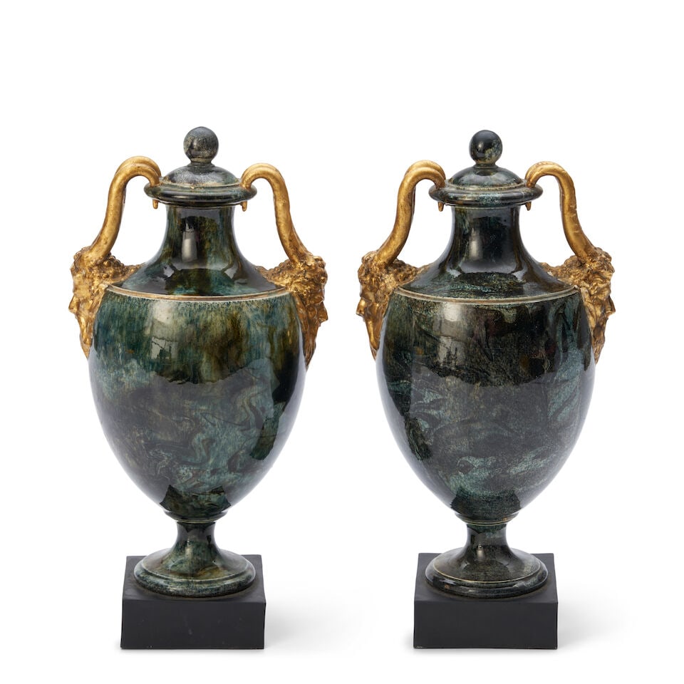 Pair of Wedgwood & Bentley Queen's Ware Vases and Covers, England, c. 1770,: Pair of Wedgwood & Bentley Queen's Ware Vases and Covers, England, c. 1770, with gilded Bacchus head and horn handles, the bodies in a mottled green, and set on black basalt plinths, impressed circula