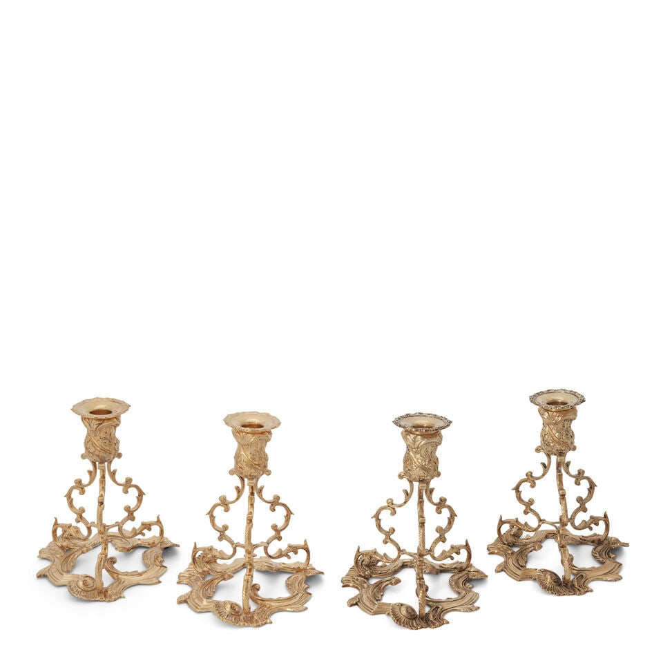 Assembled Set of Four Royal Irish Co. Gilt Sterling Silver Candleholders,: Assembled Set of Four Royal Irish Co. Gilt Sterling Silver Candleholders, Dublin, 1970 and 1978, in the Rococo style, set on a foliate molded tripart base, ht. 7 1/4, dia. 5 3/4 in., approx. 82