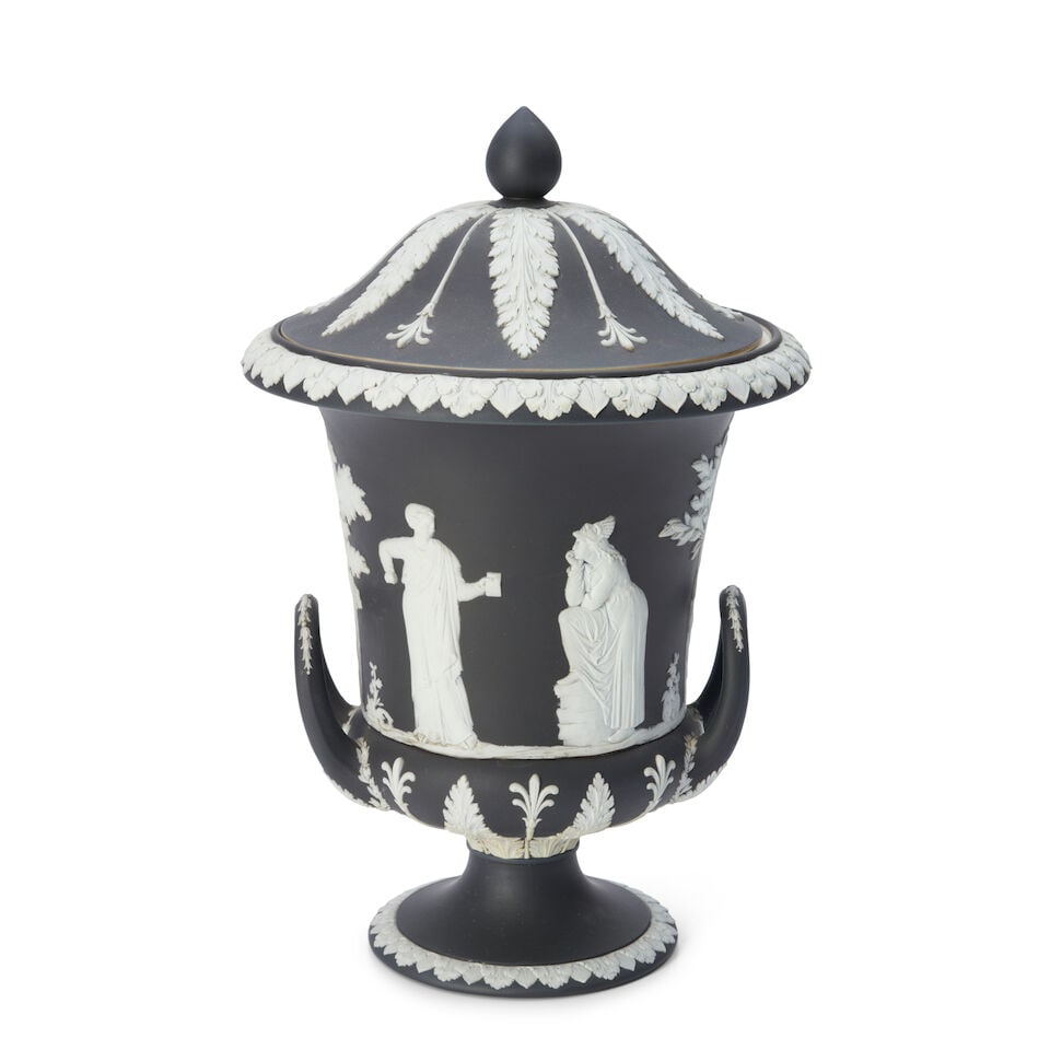 Wedgwood Black Jasper Dip Campagna Vase and Cover, England, 19th century,: Wedgwood Black Jasper Dip Campagna Vase and Cover, England, 19th century, applied white relief with classical figures bordered with foliage, impressed mark, ht. 13 1/2 in. For further information on