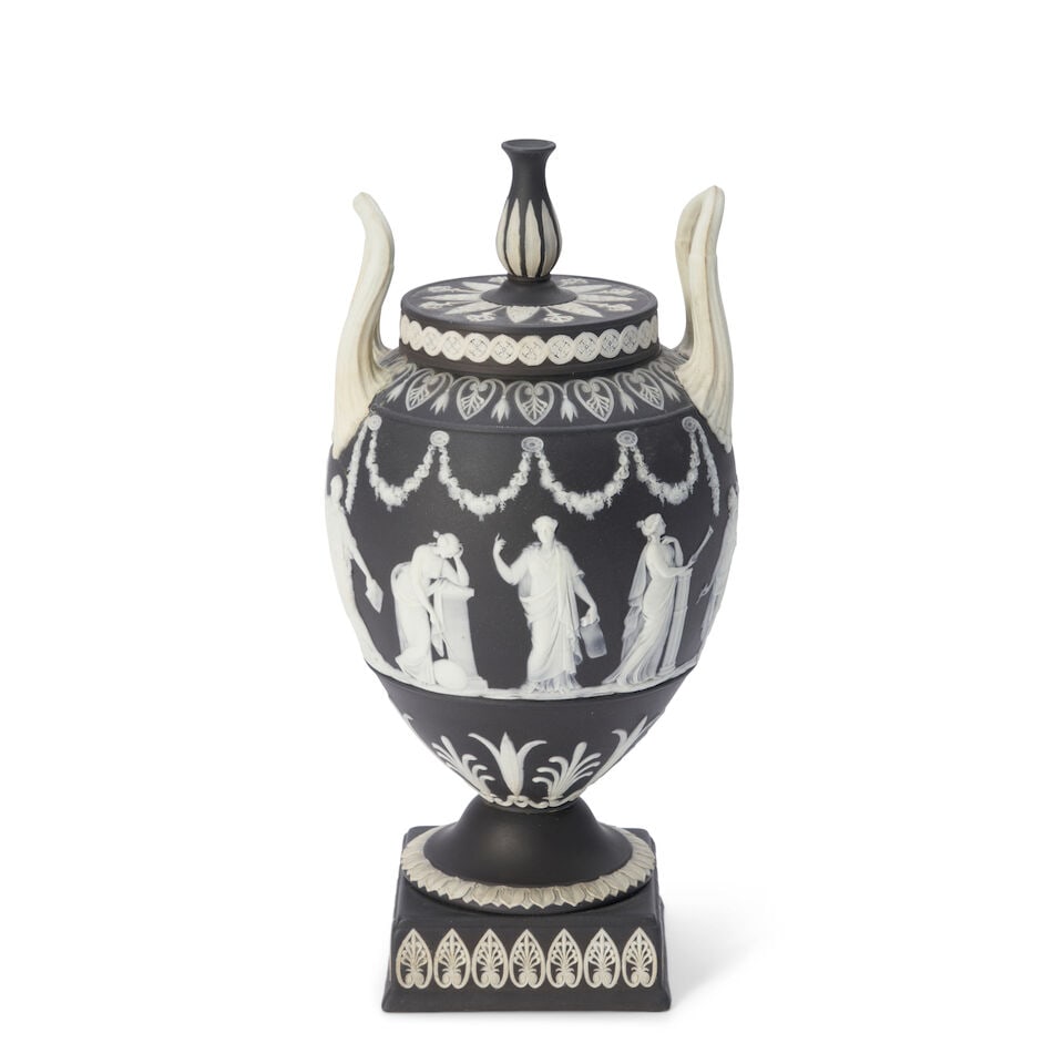 Wedgwood Black Jasper Dip Vase and Cover, England, late 19th/early 20th century,: Wedgwood Black Jasper Dip Vase and Cover, England, late 19th/early 20th century, vasiform finial and upturned loop handles, applied white relief with classical Muses below floral festoons, impressed