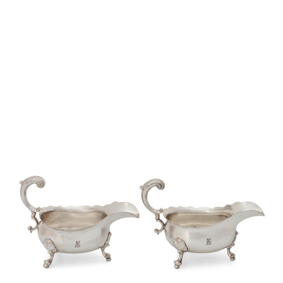 A Pair of George II Sterling Silver Waiters,: A Pair of George II Sterling Silver Waiters, London, 1752, Daniel Piers, shaped circular form with three scrolled feet, crested, dia. 8 1/2 in., approx. 35 troy oz. Saleroom notices: The weight