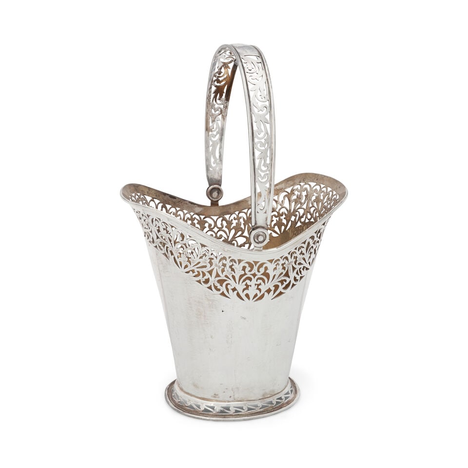 Elizabeth II Sterling Silver Bride's Basket,: Elizabeth II Sterling Silver Bride's Basket, Sheffield, 2000, C J Vander Ltd, maker, cylindrical with an openwork design under the flared rim, ht. to handle 12 in., approx. 24.25 troy oz. This lot