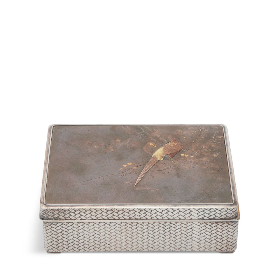 A Japanese Meiji Silver and Mixed Metal Humidor,: A Japanese Meiji Silver and Mixed Metal Humidor, 1868-1912, the cover depicting two birds perched on blossoming branches, their feathers in gold and copper, the body of the box with a trompe l'oeil