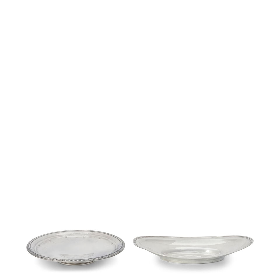 Sterling Silver Cake Plate and Bread Dish: Sterling Silver Cake Plate and Bread Dish both 20th century, the cake plate by International Silver, dia. 10; the bread dish by Frank W. Smith Silver Co., crested, lg. 12 1/2 in., approx. 17.55 troy