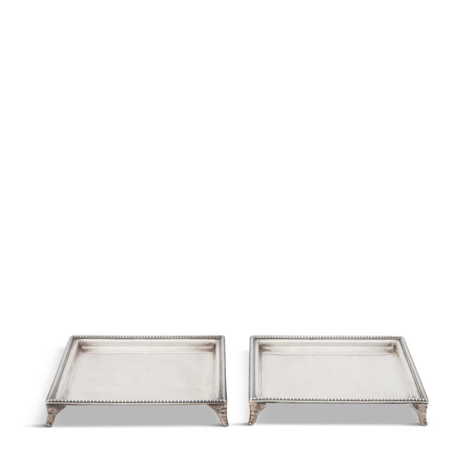 Pair of Tiffany & Co. Sterling Silver Trays,: Pair of Tiffany & Co. Sterling Silver Trays, New York, 1873-1891, square with beaded rim and raised on four splayed feet, the underside engraved 'AER/ from/ Uncle & Aunt/ W. Ravenel./ Dec 20th