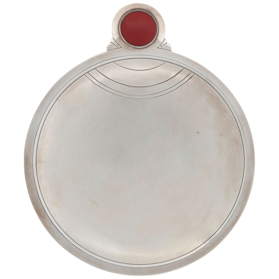 Tiffany & Co. Sterling Silver and Enamel Dish,: Tiffany & Co. Sterling Silver and Enamel Dish, New York, 1907-1938, inventory number '7485', in the Art Deco style, circular with incised lines, inset with a red enamel plaque, raise on a ring foot,