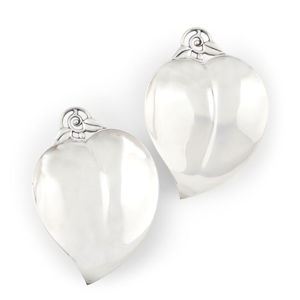 Pair of Tiffany & Co. Sterling Silver Leaf-Form Dishes,: Pair of Tiffany & Co. Sterling Silver Leaf-Form Dishes, New York, 1966-1975, ellipse shaped with a stylized cast handle, lg. 5 3/4 in., approx. 8.30 troy oz. For further information on this lot